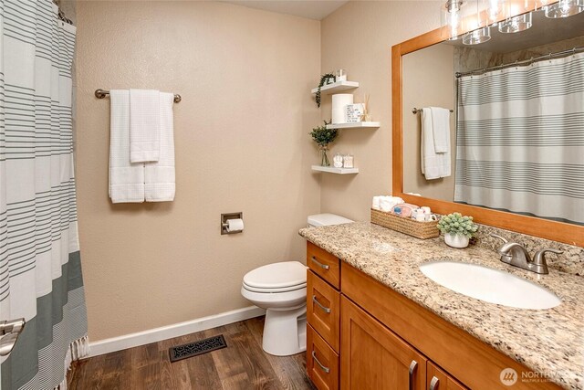 13303 53rd Ave SE, Everett, WA 98208 - full bath featuring vanity, baseboards, wood finished floors, toilet, and a shower with shower curtain