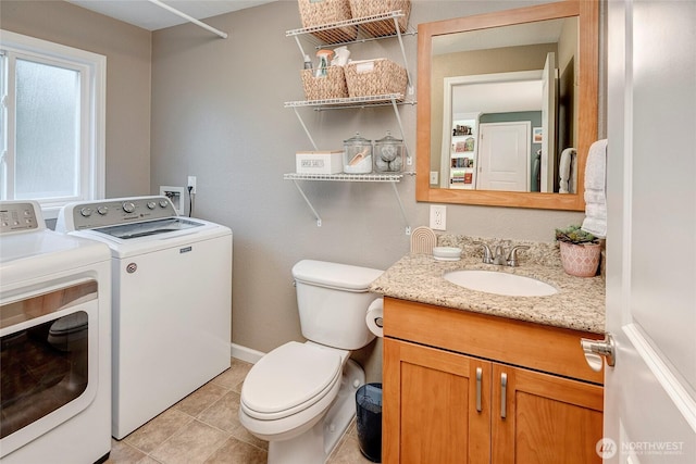 13303 53rd Ave SE, Everett, WA 98208 - bathroom with separate washer and dryer, toilet, vanity, and tile patterned flooring