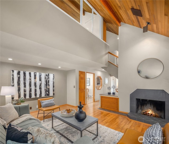 4142 52nd Ave SW, Seattle, WA 98116 - living area with light wood-type flooring, wood ceiling, vaulted ceiling, a tile fireplace, and recessed lighting