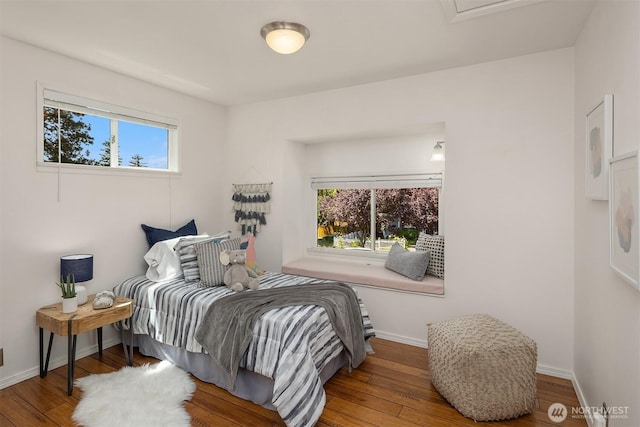 4142 52nd Ave SW, Seattle, WA 98116 - bedroom with multiple windows and wood finished floors