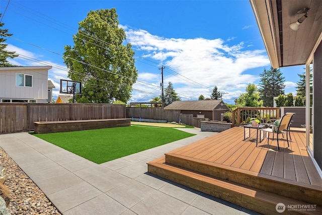 4142 52nd Ave SW, Seattle, WA 98116 - fenced backyard featuring a deck