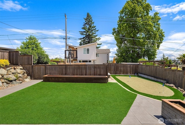 4142 52nd Ave SW, Seattle, WA 98116 - fenced backyard featuring a putting area