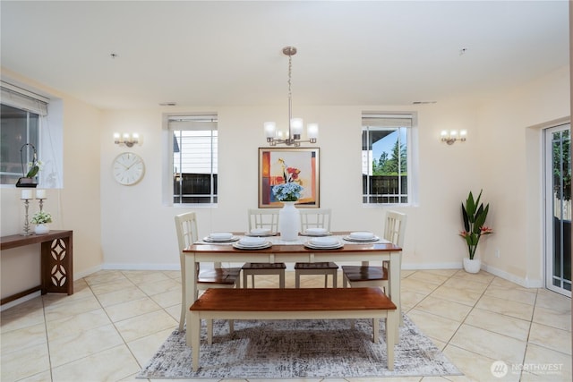 19678 Marine View Dr SW, Normandy Park, WA 98166 - dining space with a chandelier, light tile patterned floors, and healthy amount of natural light