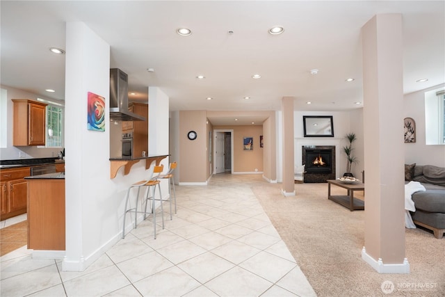 19678 Marine View Dr SW, Normandy Park, WA 98166 - living room featuring recessed lighting, light tile patterned flooring, a glass covered fireplace, and baseboards