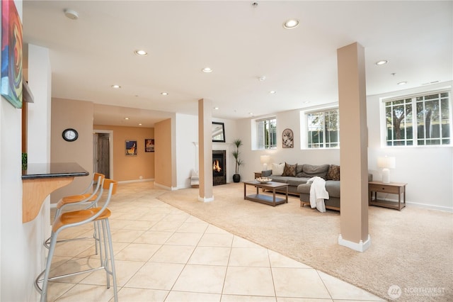 19678 Marine View Dr SW, Normandy Park, WA 98166 - living area featuring light carpet, light tile patterned floors, recessed lighting, a lit fireplace, and baseboards