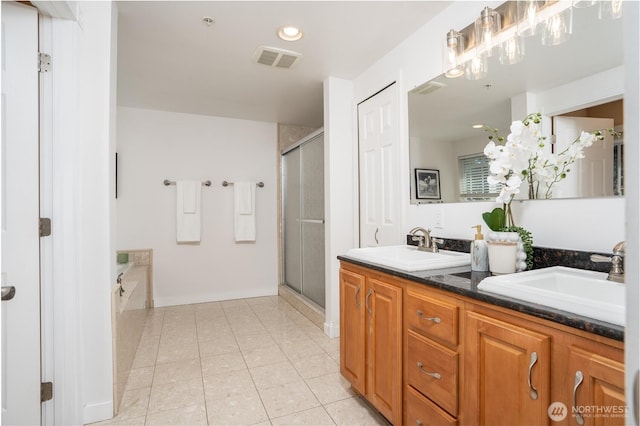 19678 Marine View Dr SW, Normandy Park, WA 98166 - bathroom featuring double vanity, a shower stall, a garden tub, tile patterned floors, and recessed lighting