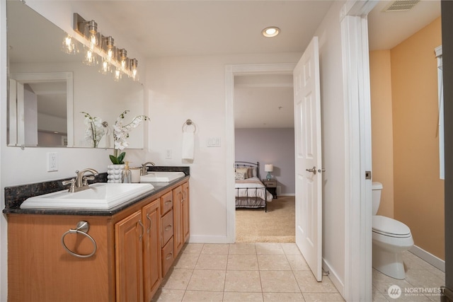 19678 Marine View Dr SW, Normandy Park, WA 98166 - full bath with double vanity, toilet, tile patterned floors, recessed lighting, and connected bathroom