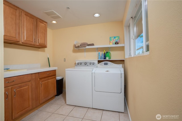 19678 Marine View Dr SW, Normandy Park, WA 98166 - washroom featuring independent washer and dryer, cabinet space, light tile patterned flooring, and recessed lighting