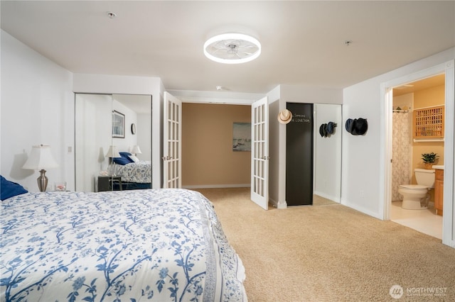 19678 Marine View Dr SW, Normandy Park, WA 98166 - bedroom with french doors, carpet, two closets, baseboards, and ensuite bath