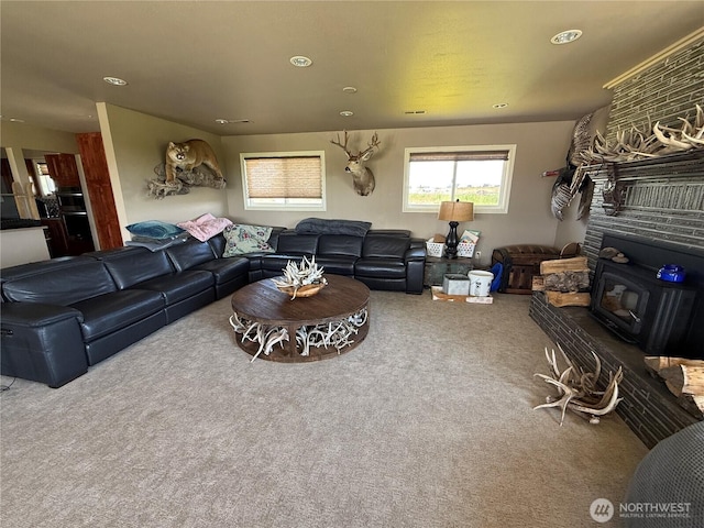 8708 Rd K Rd NE, Moses Lake, WA 98837 - living area featuring a wood stove, carpet, and recessed lighting