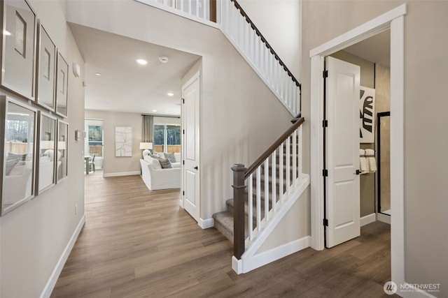 13920 181st St E Unit 64, Puyallup, WA 98374 - stairway featuring wood finished floors, baseboards, and recessed lighting