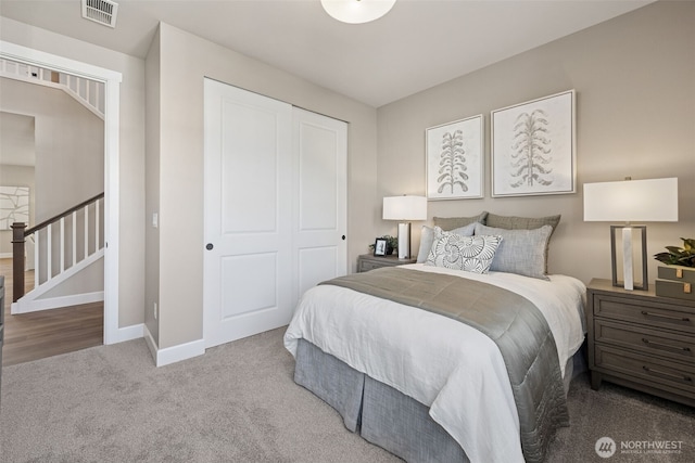 13920 181st St E Unit 64, Puyallup, WA 98374 - bedroom featuring carpet floors, baseboards, and a closet