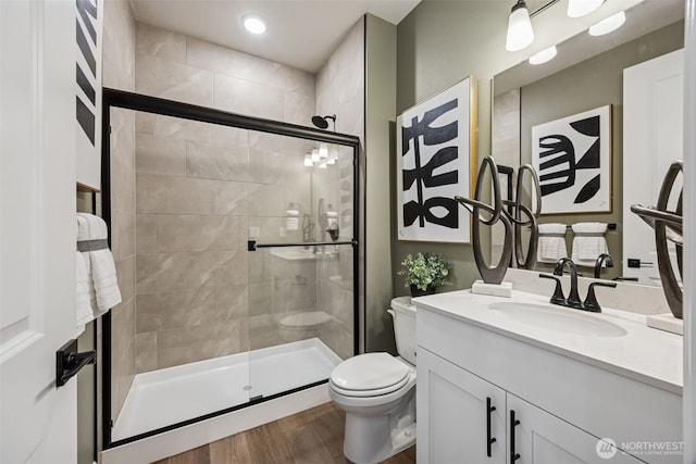 13920 181st St E Unit 64, Puyallup, WA 98374 - full bath with toilet, vanity, a shower stall, and wood finished floors