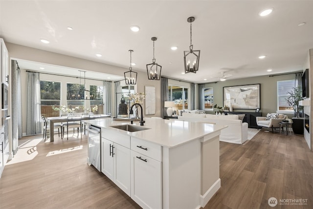 13920 181st St E Unit 64, Puyallup, WA 98374 - kitchen featuring a sink, stainless steel appliances, a chandelier, white cabinetry, and recessed lighting