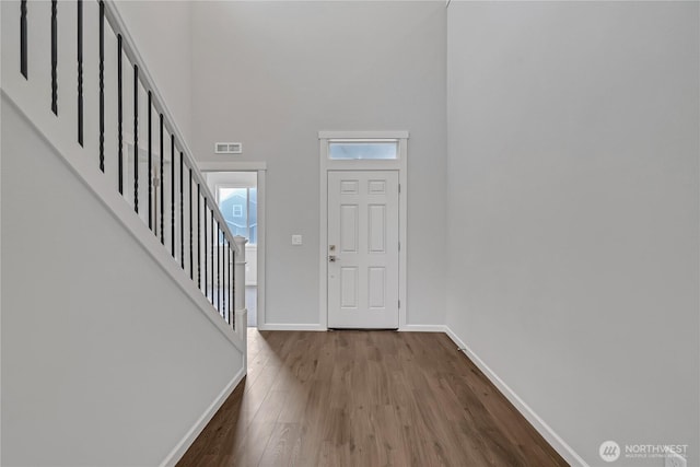 2609 S 7th Way, Ridgefield, WA 98642 - foyer featuring baseboards, a high ceiling, wood finished floors, and stairs