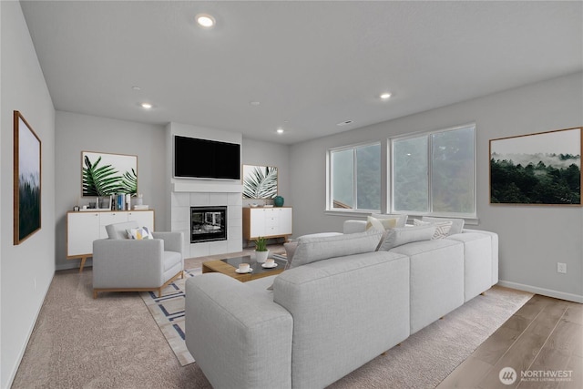 2609 S 7th Way, Ridgefield, WA 98642 - living room with wood finished floors, recessed lighting, baseboards, and a tile fireplace