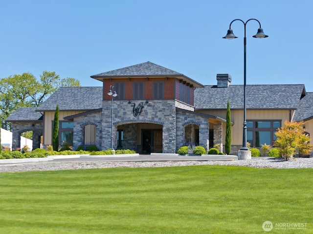 2609 S 7th Way, Ridgefield, WA 98642 - view of front of property featuring stone siding, a front yard, a shingled roof, and a chimney