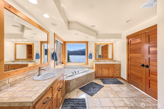 2659 Northshore Rd, Bellingham, WA 98226 - bathroom featuring a bath, two vanities, recessed lighting, and tile patterned floors