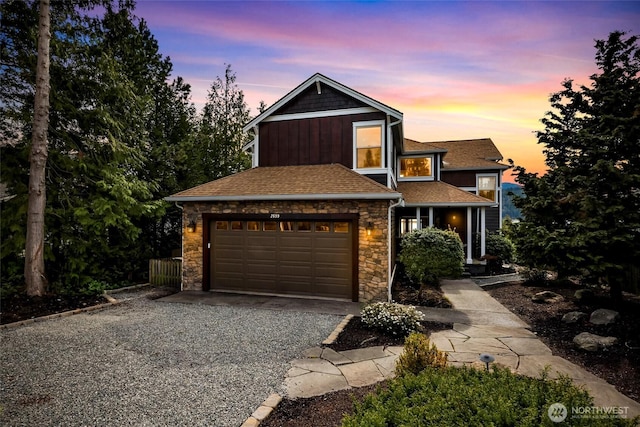 2659 Northshore Rd, Bellingham, WA 98226 - view of front of home featuring gravel driveway, a garage, stone siding, and a shingled roof