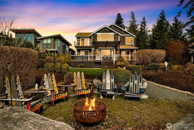 2659 Northshore Rd, Bellingham, WA 98226 - rear view of property featuring a fire pit, a wooden deck, and a balcony