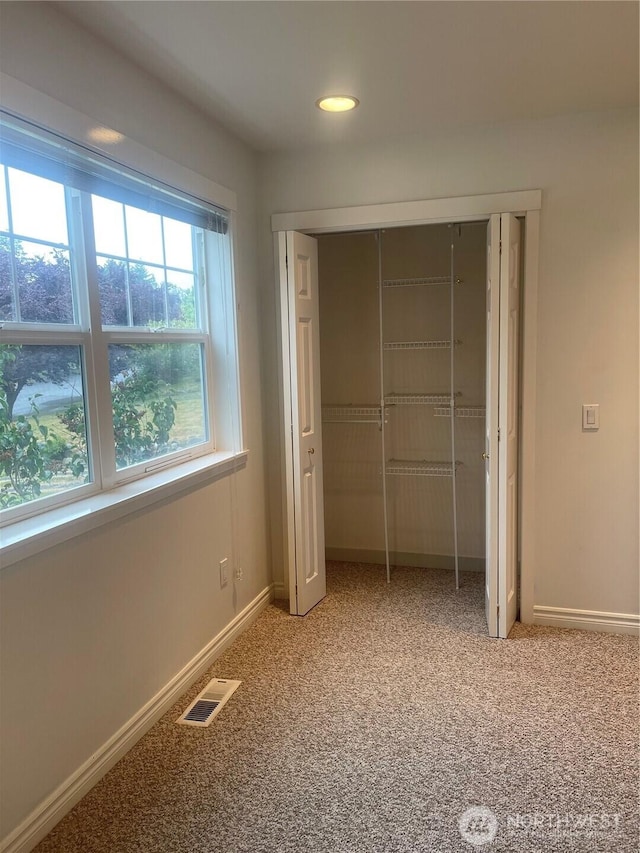 528 Chinook Way, Friday Harbor, WA 98250 - unfurnished bedroom featuring light carpet, a closet, and recessed lighting