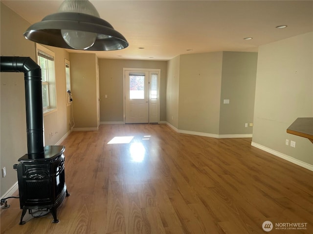 528 Chinook Way, Friday Harbor, WA 98250 - entrance foyer with wood finished floors, recessed lighting, and a wood stove