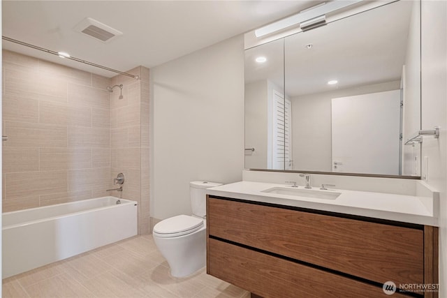 121 Stewart St Unit 3004, Seattle, WA 98101 - bathroom featuring toilet, bathtub / shower combination, vanity, and recessed lighting