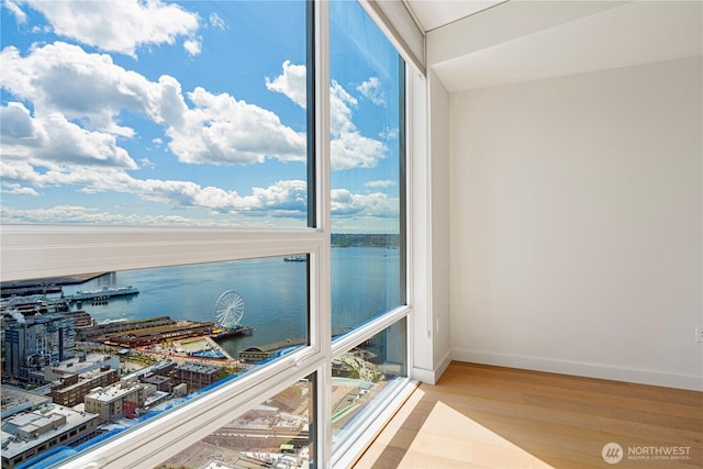 121 Stewart St Unit 3004, Seattle, WA 98101 - sunroom / solarium featuring a water view and healthy amount of natural light