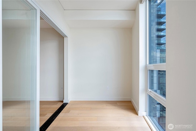 121 Stewart St Unit 3004, Seattle, WA 98101 - hall with wood finished floors and baseboards