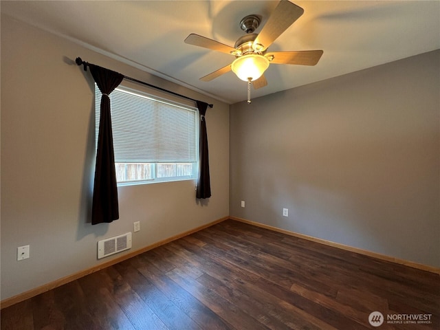 2116 E 65th St, Tacoma, WA 98404 - unfurnished room with dark wood finished floors, baseboards, and ceiling fan