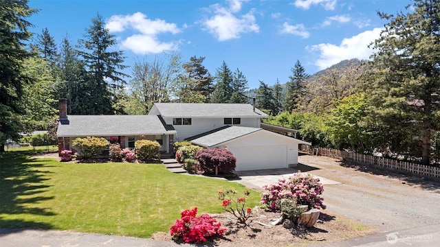 28713 SE 462nd Pl, Enumclaw, WA 98022 - tri-level home with driveway, a garage, and a chimney