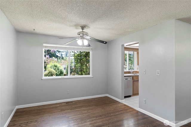 28713 SE 462nd Pl, Enumclaw, WA 98022 - empty room featuring ceiling fan, wood finished floors, a sink, a textured ceiling, and baseboards