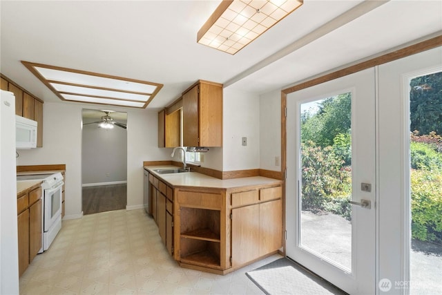 28713 SE 462nd Pl, Enumclaw, WA 98022 - kitchen featuring white appliances, a sink, light flooring, light countertops, and a ceiling fan