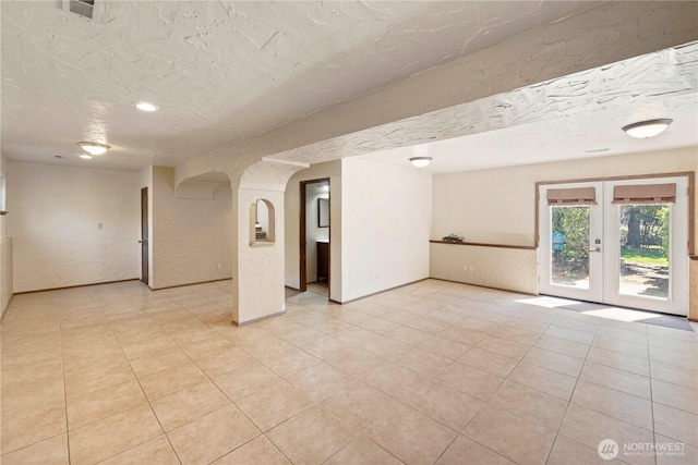 28713 SE 462nd Pl, Enumclaw, WA 98022 - spare room with french doors, a textured ceiling, and light tile patterned floors
