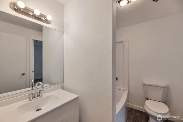 1702 C St SE, Auburn, WA 98002 - full bath with vanity, toilet, and wood finished floors