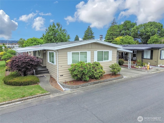 1402 22nd St NE Unit 47, Auburn, WA 98002 - view of front facade with board and batten siding