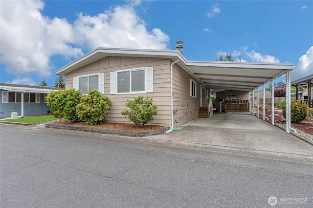 1402 22nd St NE Unit 47, Auburn, WA 98002 - view of front of property featuring an attached carport