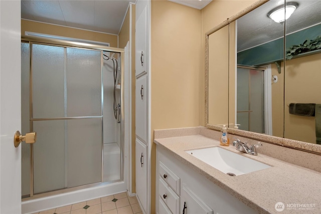1402 22nd St NE Unit 47, Auburn, WA 98002 - bathroom with vanity, a stall shower, and tile patterned flooring