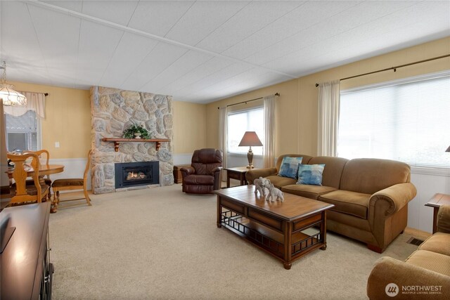 1402 22nd St NE Unit 47, Auburn, WA 98002 - carpeted living area featuring a fireplace