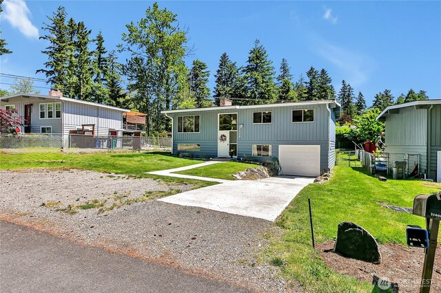 31006 38th Ave S, Auburn, WA 98001 - split foyer home with driveway, an attached garage, and a chimney