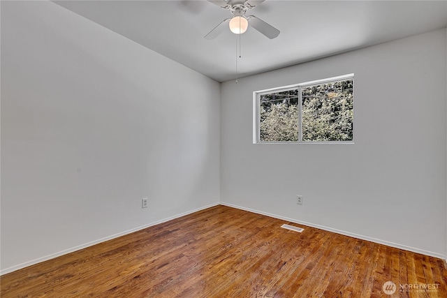 31006 38th Ave S, Auburn, WA 98001 - unfurnished room featuring wood finished floors, baseboards, and a ceiling fan
