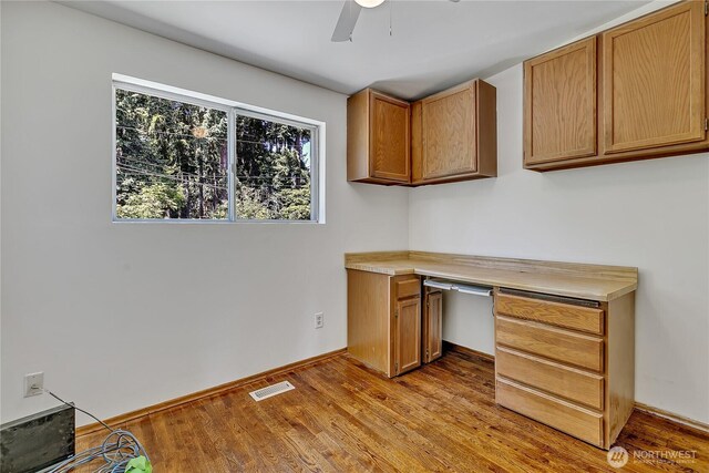 31006 38th Ave S, Auburn, WA 98001 - unfurnished office featuring light wood-style flooring, a ceiling fan, built in study area, and baseboards