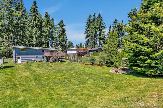 31006 38th Ave S, Auburn, WA 98001 - view of yard featuring a wooden deck, stairway, and a garden