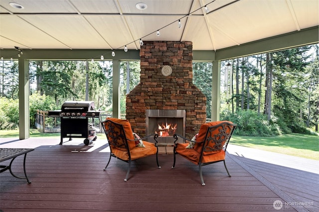 1566 Deer Ridge Rd, Oak Harbor, WA 98277 - wooden deck featuring an outdoor stone fireplace and a grill