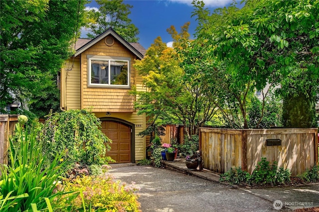 444 26th Ave E, Seattle, WA 98112 - view of front of property featuring driveway and an attached garage