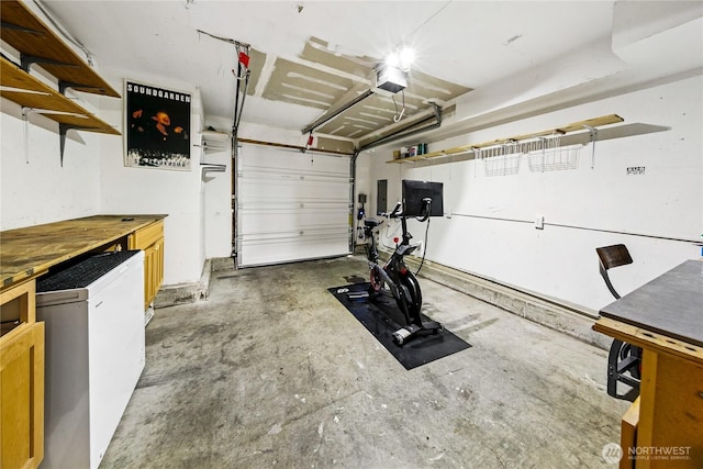 444 26th Ave E, Seattle, WA 98112 - garage featuring a garage door opener and refrigerator