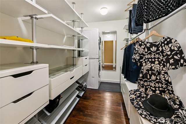 444 26th Ave E, Seattle, WA 98112 - walk in closet featuring stacked washer and clothes dryer and dark wood-style flooring