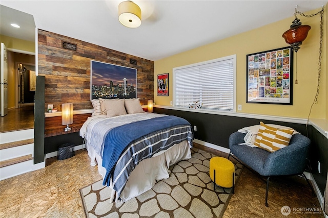 444 26th Ave E, Seattle, WA 98112 - bedroom featuring wooden walls, an accent wall, and recessed lighting