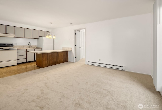 11012 NE 68th St Unit 511, Kirkland, WA 98033 - kitchen featuring a baseboard radiator, white appliances, light colored carpet, light countertops, and decorative light fixtures
