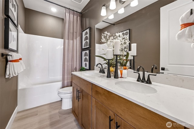 13912 181st St E Unit 62, Puyallup, WA 98374 - bathroom with double vanity, shower / tub combo, toilet, and wood finished floors